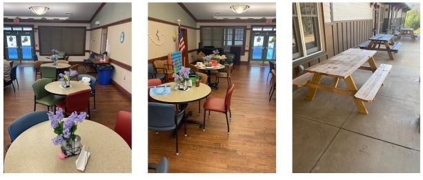 A large room with chairs and round tables; picnic tables with benches